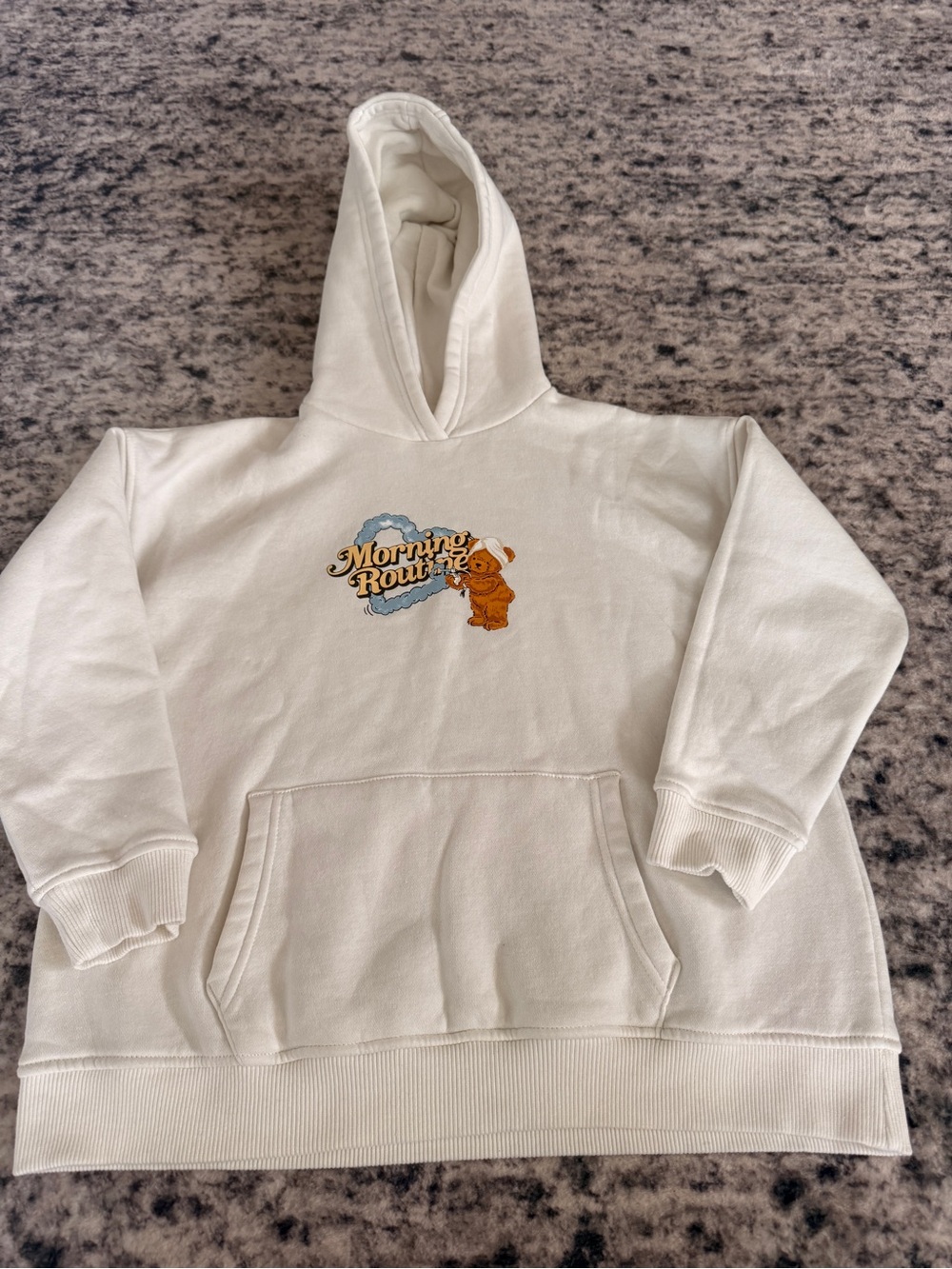 Primark Cream Hoodie with 'Morning Routine' Cartoon Motif